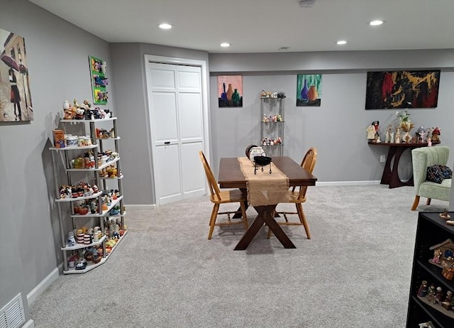 carpeted dining room featuring recessed lighting and baseboards