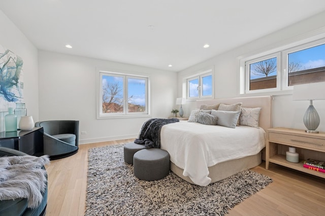 bedroom featuring wood finished floors and recessed lighting