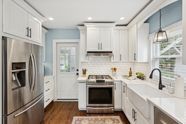 225 N Knight Ave, Park Ridge, IL 60068 - kitchen featuring appliances with stainless steel finishes, under cabinet range hood, plenty of natural light, light countertops, and recessed lighting