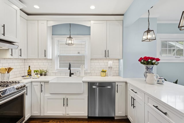 225 N Knight Ave, Park Ridge, IL 60068 - kitchen featuring stainless steel appliances, a sink, white cabinetry, decorative light fixtures, and recessed lighting