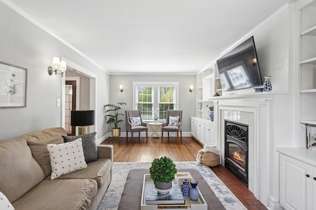 225 N Knight Ave, Park Ridge, IL 60068 - living room featuring a tiled fireplace, crown molding, and built in shelves