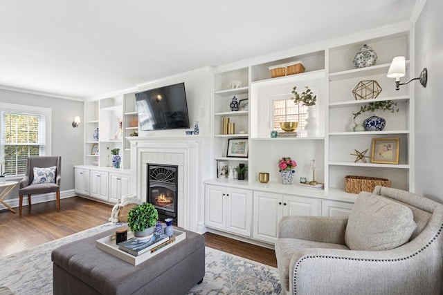 225 N Knight Ave, Park Ridge, IL 60068 - living room featuring dark wood-style floors, a tile fireplace, crown molding, and built in features