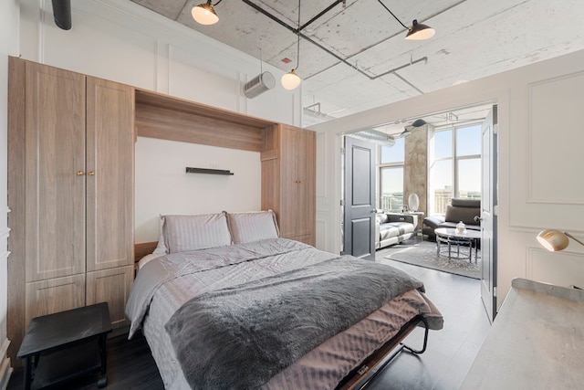 bedroom featuring wood finished floors