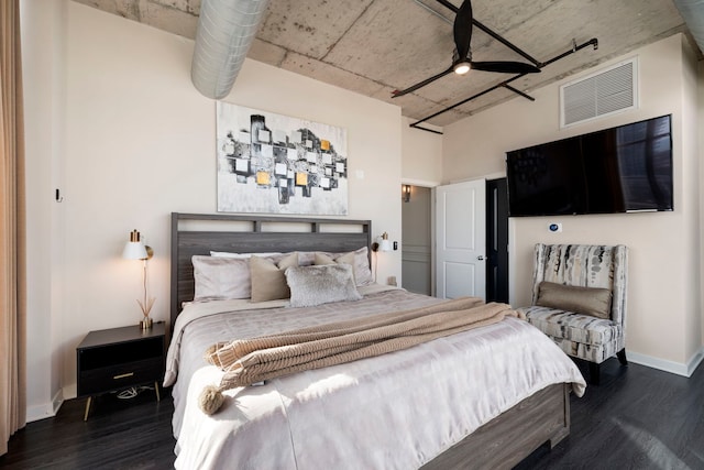 bedroom with wood finished floors, baseboards, and ceiling fan