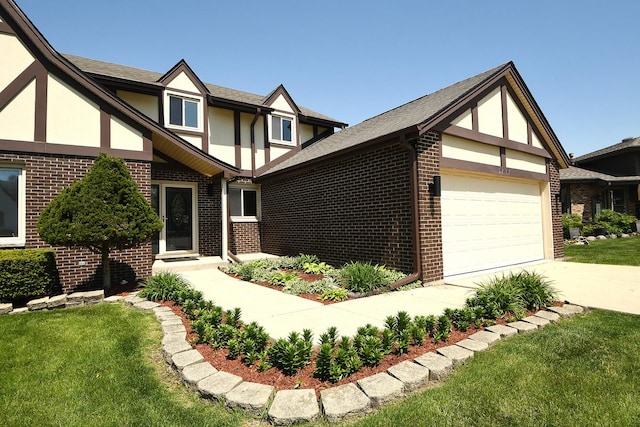 tudor-style house featuring brick siding, a garage, stucco siding, and a front lawn