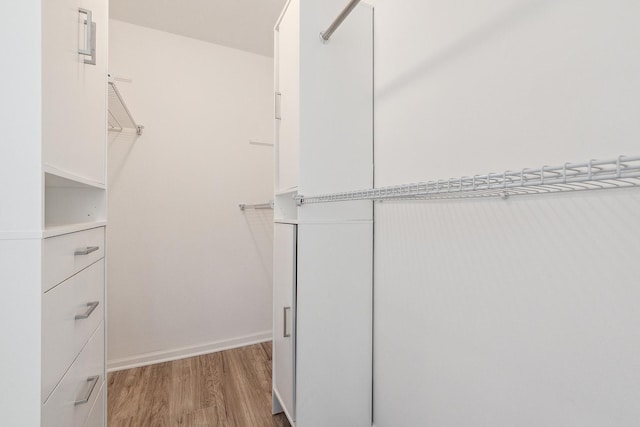 walk in closet featuring light wood-style floors