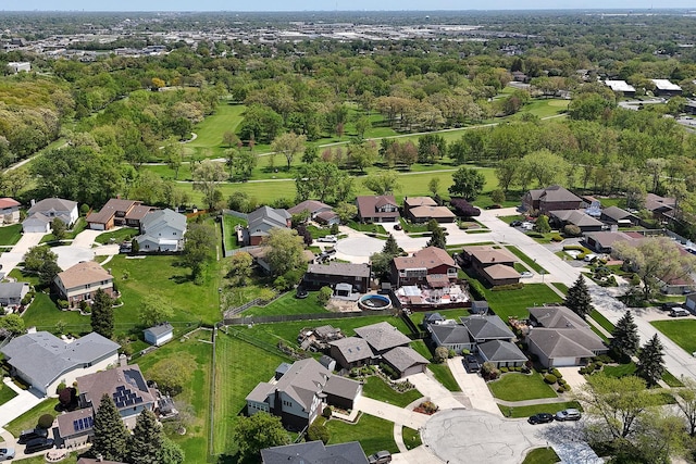 aerial view of property and surrounding area with nearby suburban area