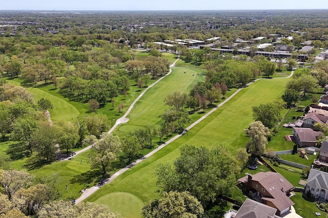 aerial overview of property's location with nearby suburban area and a local golf course