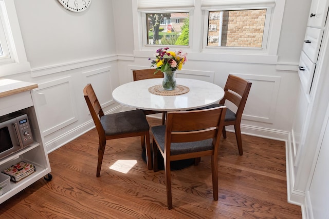 4937 N Opal Ave, Norridge, IL 60706 - dining room featuring a decorative wall, wood finished floors, and a wainscoted wall