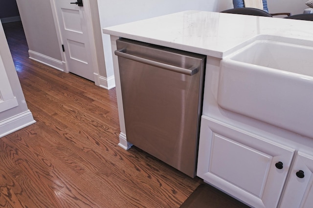 4937 N Opal Ave, Norridge, IL 60706 - kitchen view of stainless steel dishwasher, dark wood-type flooring, and baseboards