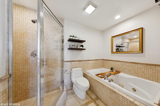 1907 W Chicago Ave Unit 3, Chicago, IL 60622 - bathroom featuring a stall shower, a garden tub, tile patterned flooring, toilet, and tile walls