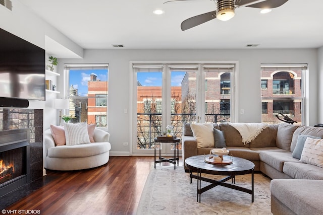 1907 W Chicago Ave Unit 3, Chicago, IL 60622 - living area with a tiled fireplace, wood finished floors, ceiling fan, recessed lighting, and baseboards