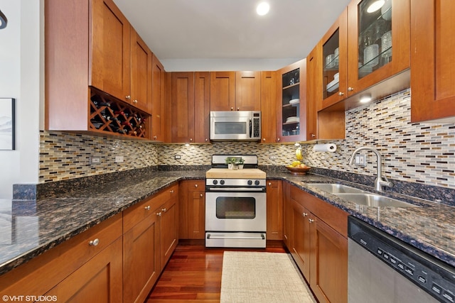 1907 W Chicago Ave Unit 3, Chicago, IL 60622 - kitchen featuring appliances with stainless steel finishes, a sink, dark wood-type flooring, and brown cabinetry