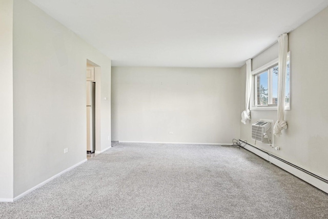 unfurnished room featuring baseboard heating, carpet, a wall mounted air conditioner, and baseboards