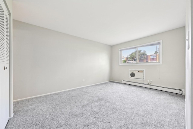 unfurnished bedroom featuring carpet, a baseboard heating unit, a closet, and baseboards