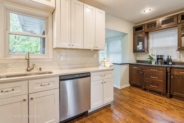 496 Longcommon Rd, Riverside, IL 60546 - kitchen featuring stainless steel dishwasher, a sink, white cabinetry, dark wood finished floors, and glass insert cabinets