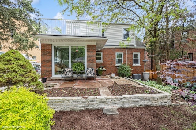 496 Longcommon Rd, Riverside, IL 60546 - rear view of property featuring a patio area, central AC unit, and brick siding