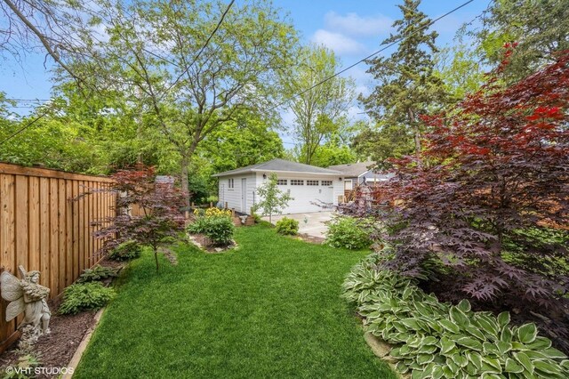 496 Longcommon Rd, Riverside, IL 60546 - view of yard featuring a garage