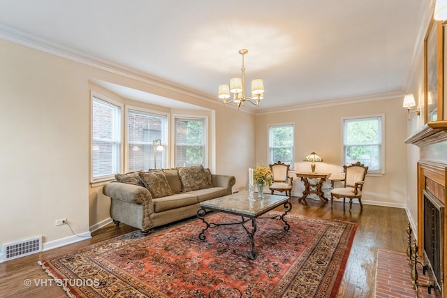 496 Longcommon Rd, Riverside, IL 60546 - living area with crown molding, a brick fireplace, a chandelier, dark wood-type flooring, and baseboards