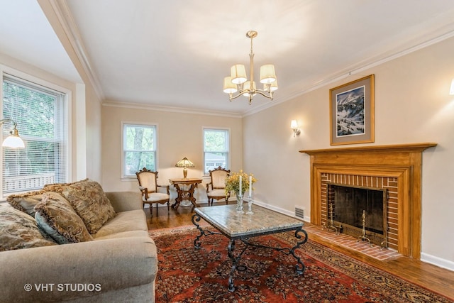 496 Longcommon Rd, Riverside, IL 60546 - living area with wood finished floors, crown molding, a chandelier, baseboards, and a fireplace