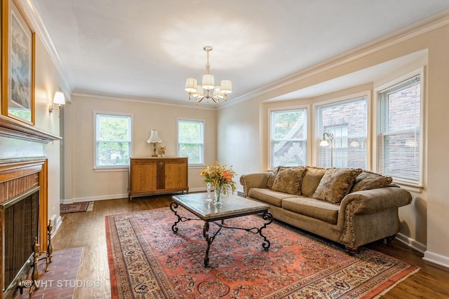 496 Longcommon Rd, Riverside, IL 60546 - living area with ornamental molding, a chandelier, wood finished floors, baseboards, and a brick fireplace