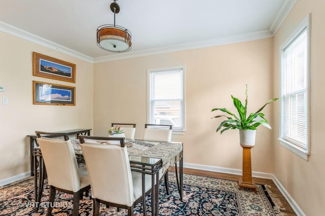 496 Longcommon Rd, Riverside, IL 60546 - dining space featuring crown molding, baseboards, wood finished floors, and plenty of natural light