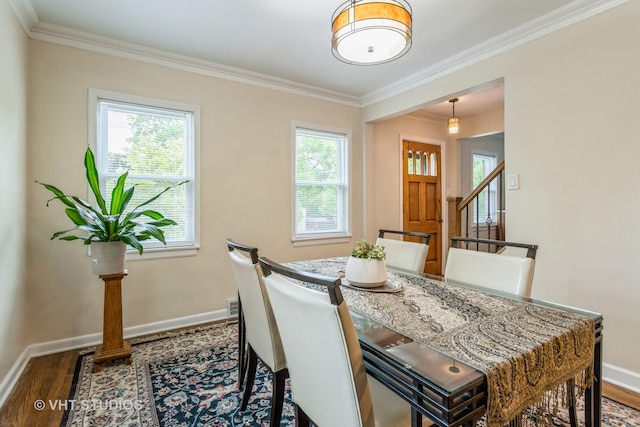 496 Longcommon Rd, Riverside, IL 60546 - dining area with dark wood-style floors, plenty of natural light, baseboards, and crown molding