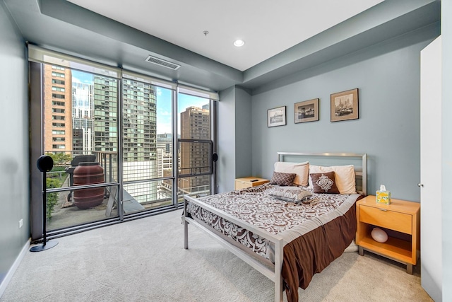 240 E Illinois St Unit 1004, Chicago, IL 60611 - carpeted bedroom with a city view, baseboards, floor to ceiling windows, and recessed lighting