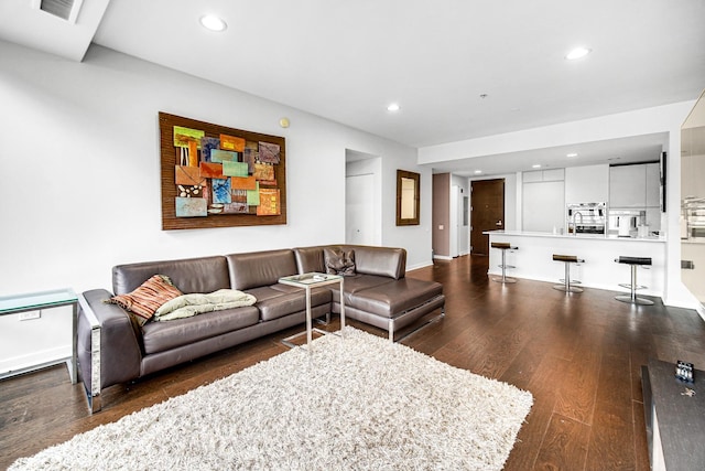 240 E Illinois St Unit 1004, Chicago, IL 60611 - living area featuring dark wood finished floors, recessed lighting, and baseboards