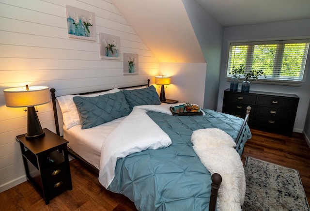 139 Walnut Hill Dr, Galena, IL 61036 - bedroom featuring wood finished floors, vaulted ceiling, baseboards, and wooden walls