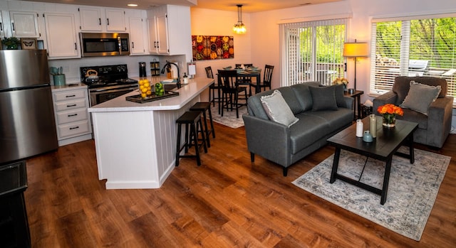 139 Walnut Hill Dr, Galena, IL 61036 - living area featuring dark wood finished floors and recessed lighting