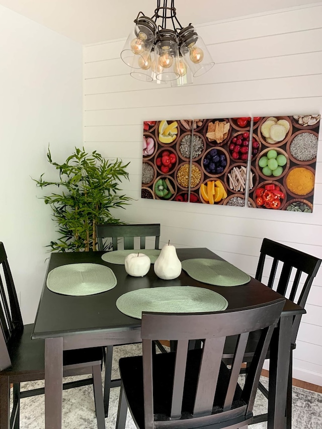 139 Walnut Hill Dr, Galena, IL 61036 - dining space with a chandelier and wooden walls