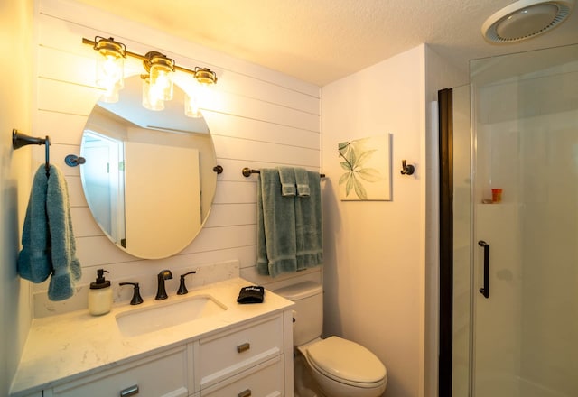 139 Walnut Hill Dr, Galena, IL 61036 - bathroom with a shower stall, a textured ceiling, toilet, and vanity