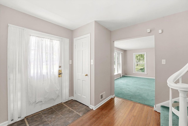 255 Irving Blvd, Chicago Heights, IL 60411 - entrance foyer with baseboards, carpet flooring, and hardwood / wood-style floors