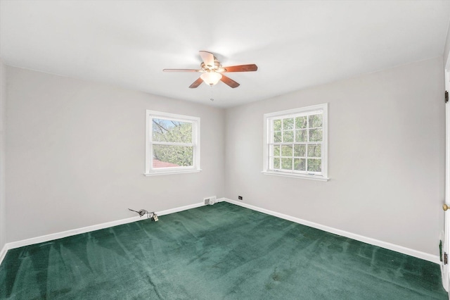 255 Irving Blvd, Chicago Heights, IL 60411 - spare room featuring ceiling fan, dark colored carpet, baseboards, and plenty of natural light
