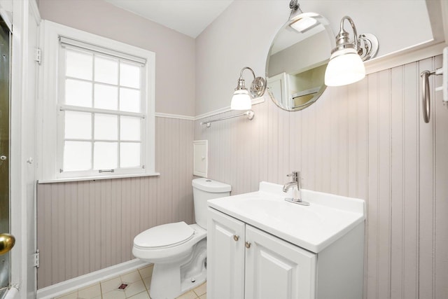 255 Irving Blvd, Chicago Heights, IL 60411 - bathroom featuring toilet, tile patterned flooring, vanity, and wainscoting