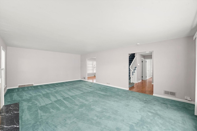 255 Irving Blvd, Chicago Heights, IL 60411 - spare room featuring stairway, carpet floors, and baseboards