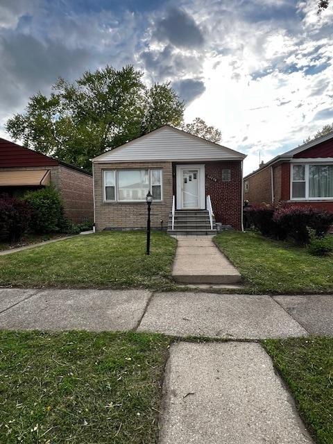 14230 S State St, Riverdale, IL 60827 - bungalow-style home featuring brick siding and a front lawn