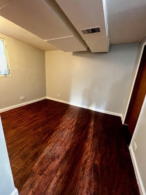 14230 S State St, Riverdale, IL 60827 - unfurnished room featuring wood finished floors and baseboards