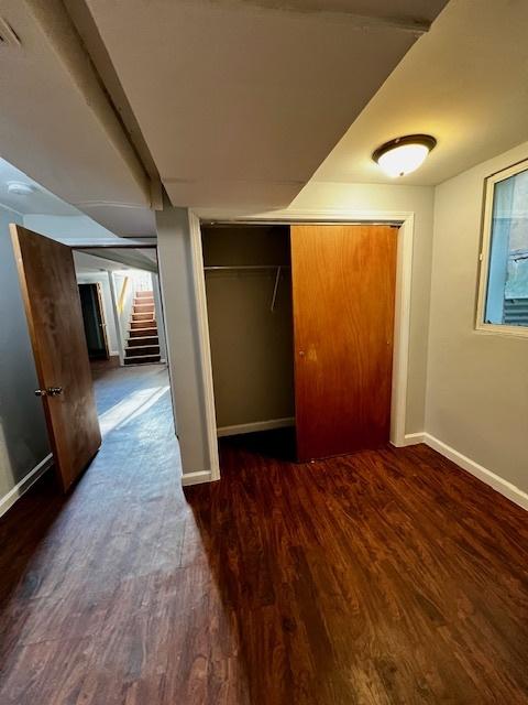 14230 S State St, Riverdale, IL 60827 - unfurnished bedroom with baseboards, wood finished floors, and a closet