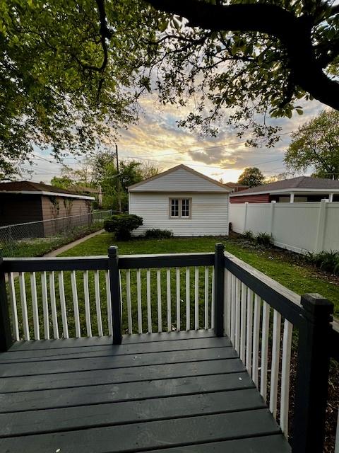 14230 S State St, Riverdale, IL 60827 - wooden deck featuring an outdoor structure