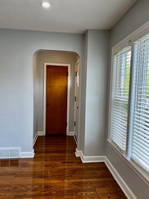 14230 S State St, Riverdale, IL 60827 - hall featuring arched walkways, healthy amount of natural light, baseboards, and recessed lighting