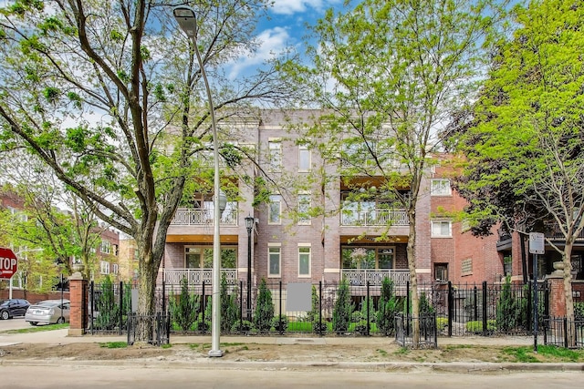 view of building exterior with a fenced front yard