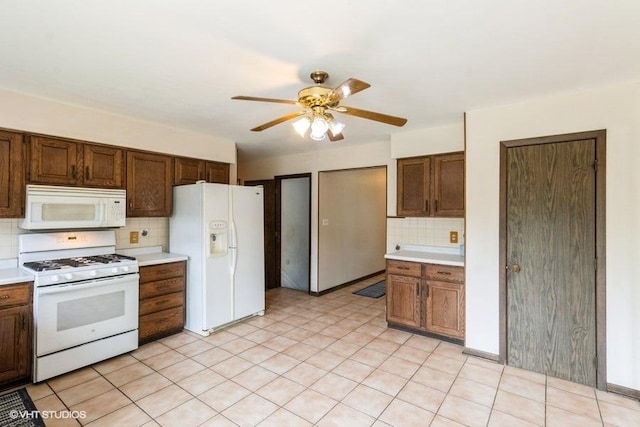 11616 Ronald St, Huntley, IL 60142 - kitchen featuring white appliances, tasteful backsplash, light countertops, and ceiling fan