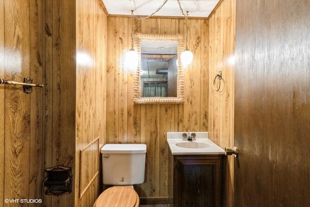 11616 Ronald St, Huntley, IL 60142 - bathroom with toilet, wood walls, and vanity