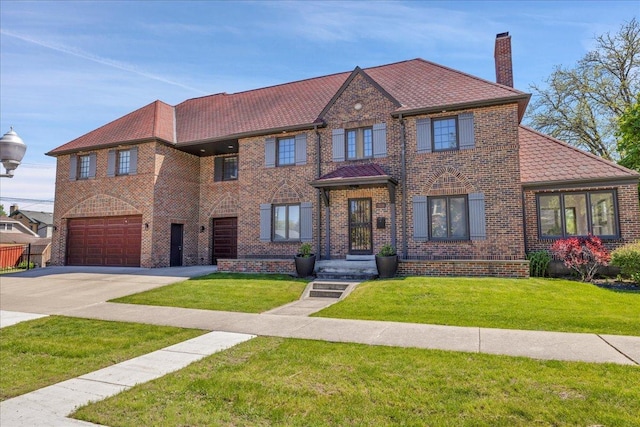 7439 W Lunt Ave, Chicago, IL 60631 - view of front of property with a chimney, a garage, concrete driveway, and a front yard