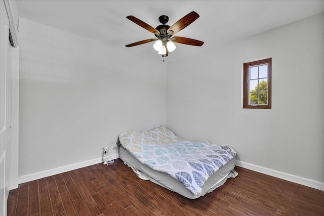 7439 W Lunt Ave, Chicago, IL 60631 - bedroom with baseboards, wood finished floors, and ceiling fan