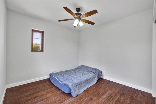 7439 W Lunt Ave, Chicago, IL 60631 - bedroom with wood finished floors, baseboards, and a ceiling fan
