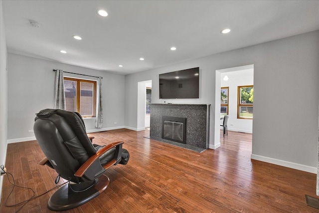 7439 W Lunt Ave, Chicago, IL 60631 - living room with a tile fireplace, recessed lighting, wood finished floors, and baseboards