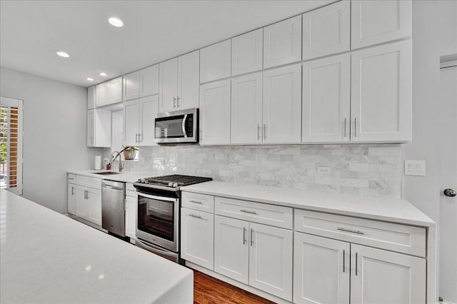 7439 W Lunt Ave, Chicago, IL 60631 - kitchen with appliances with stainless steel finishes, light countertops, and recessed lighting